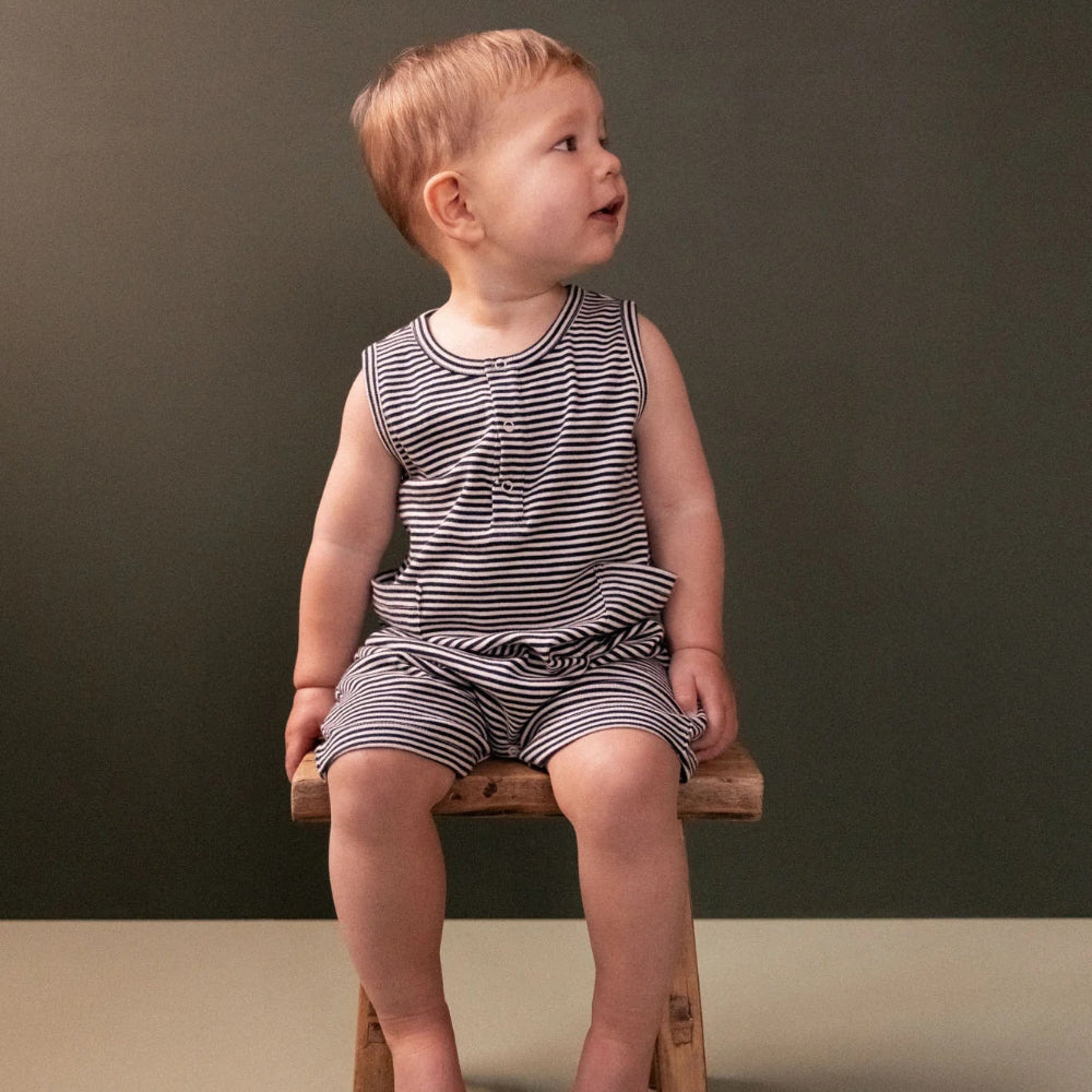 Nature Baby Camper Suit in a soft cotton navy stripe at Cerise Sleeveless for comfort with a front button closure.