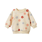 Nature Baby Emerson Flora Stamp Sweater for Babies and Kids at Cerise.  Features cute floral stamp print  on a natural coloured basecloth and is made from 100% cotton.