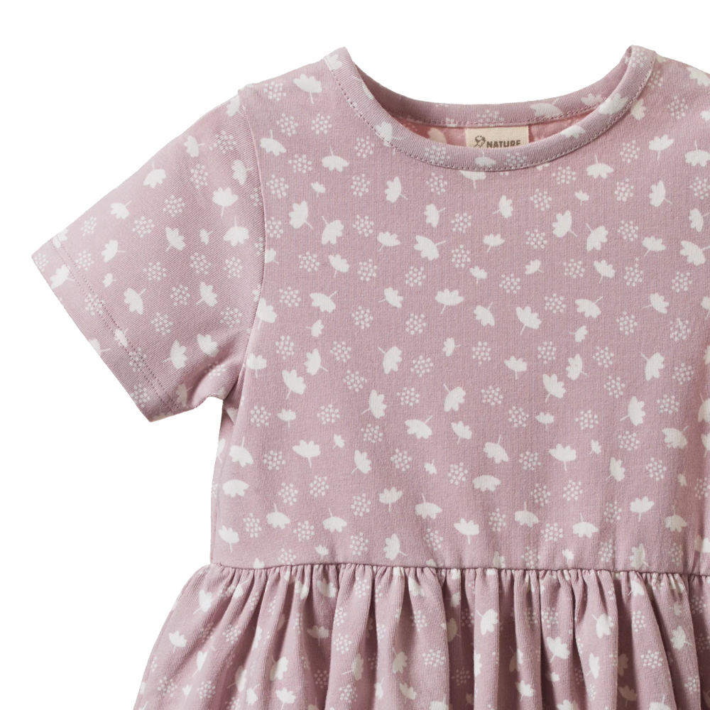 Nature Baby Saturday Dress in Dandelion Lilac Print with elastic waist, gathered skirt and short sleeves at Cerise