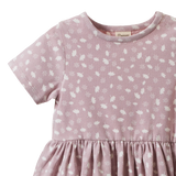 Nature Baby Saturday Dress in Dandelion Lilac Print with elastic waist, gathered skirt and short sleeves at Cerise