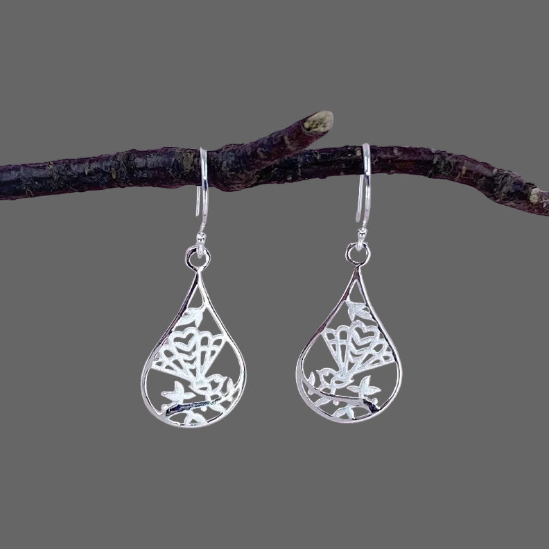 Silver Teardrop shaped earrings with a stencilled NZ fantail (pikwakawaka) design