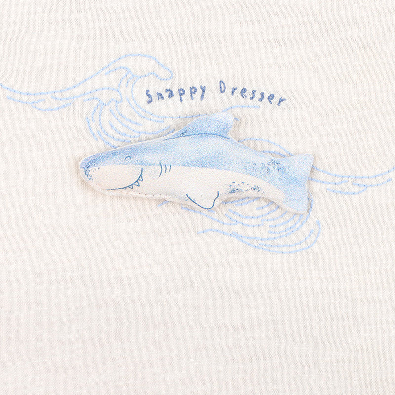 Baby short sleeved onesie with embroidered blue shark motive and snappy dresser words on a natural 100% cotton fabric