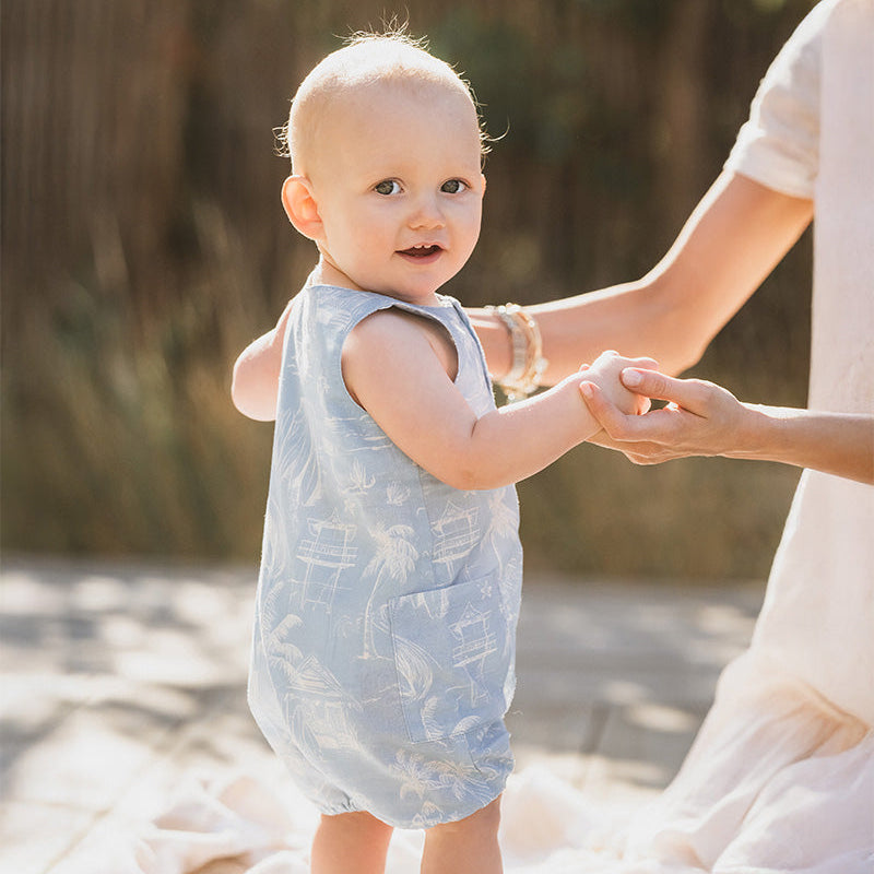 Light blue rompr with white all over palm tree pattern