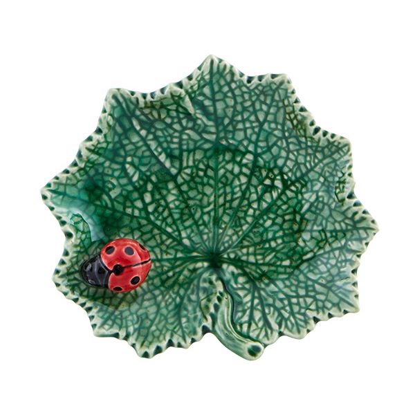 Ceramic leaf-shaped dish with a ladybug on a white background