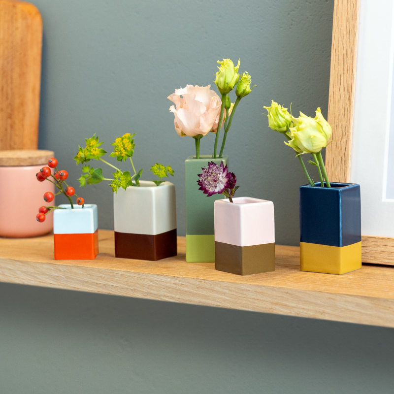 This Set of five Remember porcelain colour dipped Mini Vases at Cerise  come in different colours and sizes and look amazing with one or two flowers or simply displayed as they are.  the tallest is 75mm and the shortest 38mm