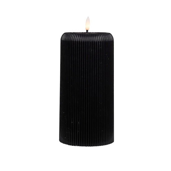 Black ribbed wax candle with LED flame