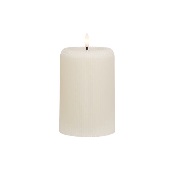 Small cream ribbed wax candle with LED flame