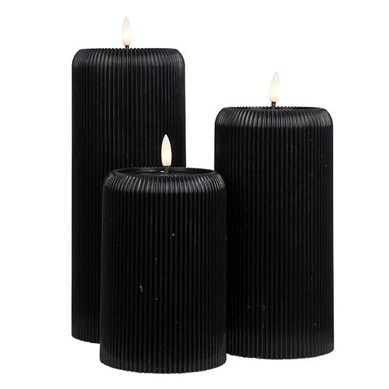 Set of 3 different height black ribbed candles with LED flame
