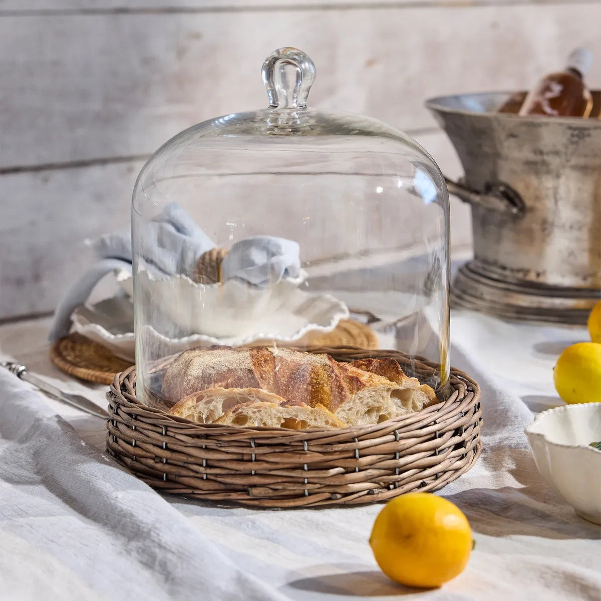 Riviera large cake dome with rattan base and glass dome top