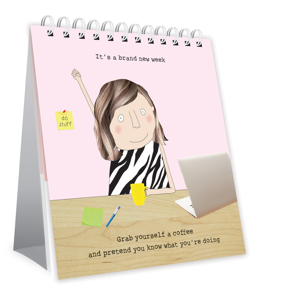 Desk calendar with illustration of a person at a desk and humorous text on a pink background
