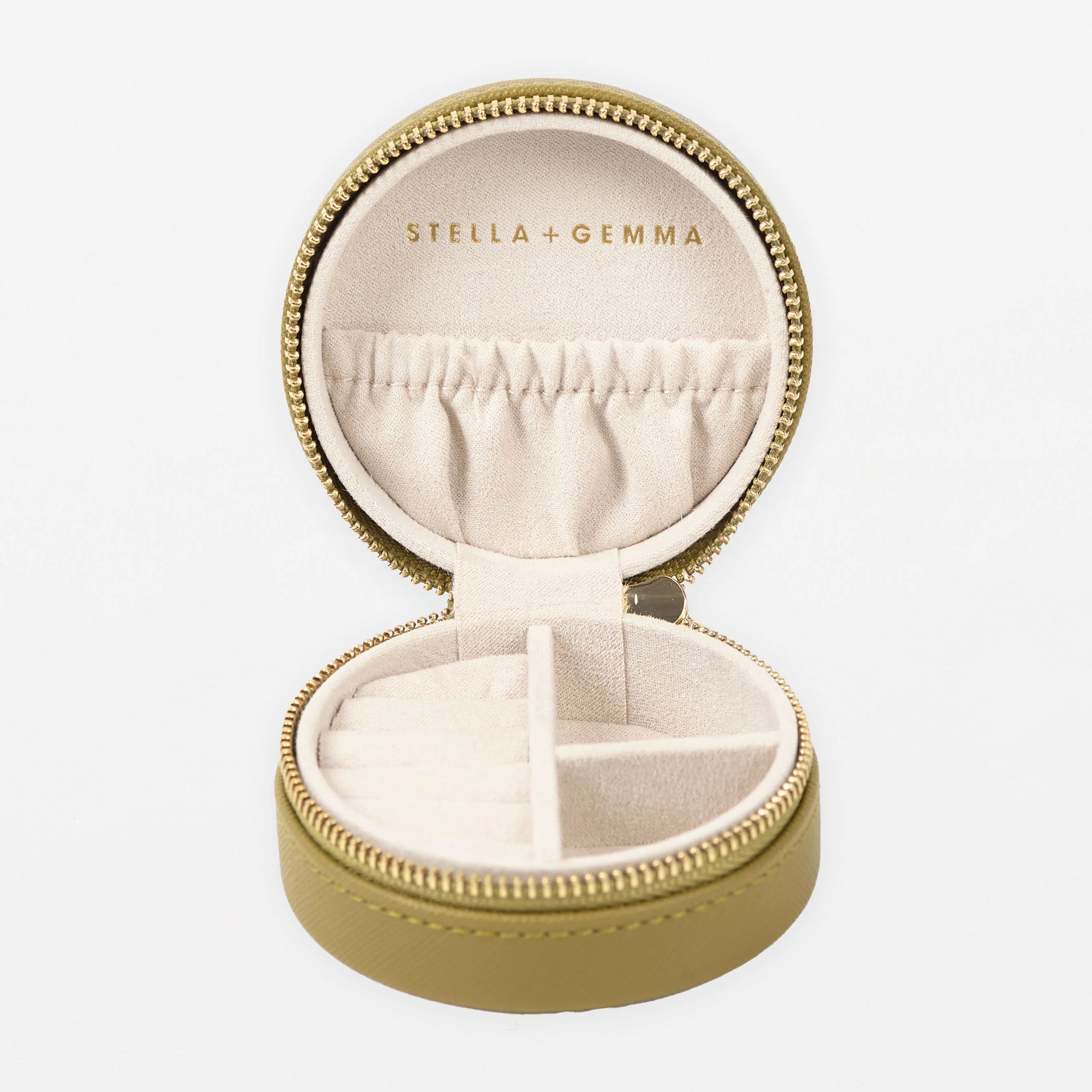 Khaki Coloured round  Jewel Box with gold zip - Inside photo showing places for your jewels and Stella & gemma branded logo.