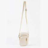 White crossbody bag on a light beige background