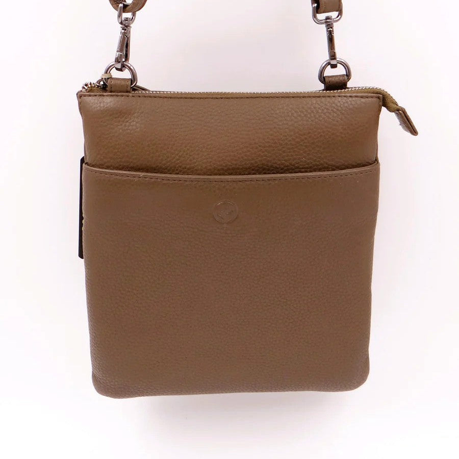 tan leather crossbody bag on a white background