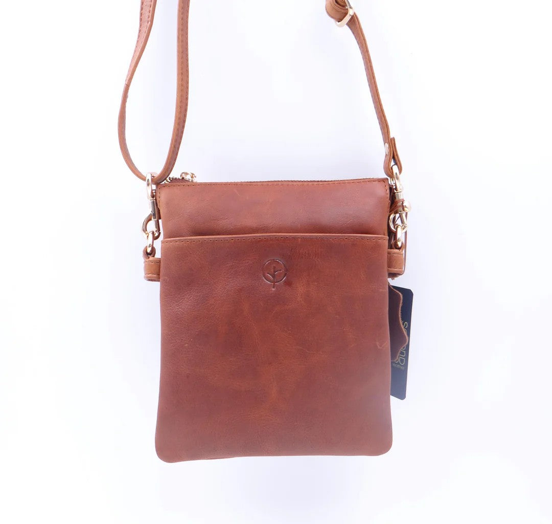 Tan leather crossbody bag with a visible brand logo on a white background