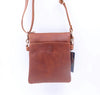 Tan leather crossbody bag with a visible brand logo on a white background