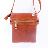 Tan leather crossbody bag with gold zipper on a white background