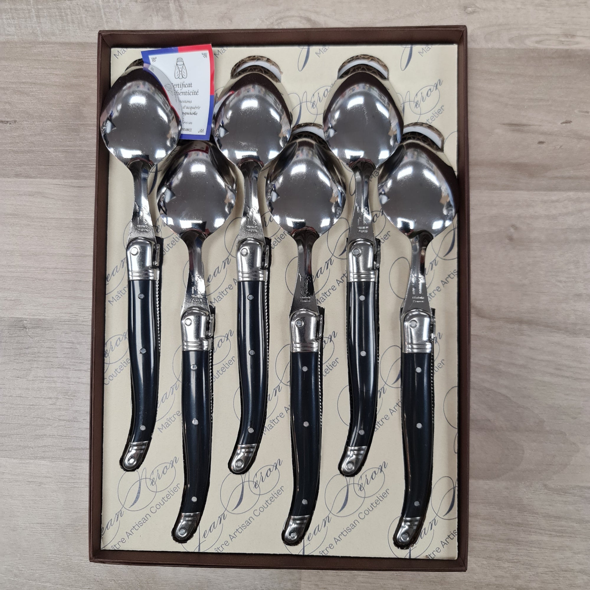 Set of 6 Laguiole by Jean Neron Black handles desert spoons with Bee icon. Presented in a gift box at Cerise NZ