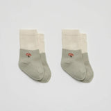 Over the Dandelions Set of 2 Baby Socks in sage green and ivory Mushroom design at Cerise. Made from soft organic cotton to fit newborn babies size 0 to 6 months.