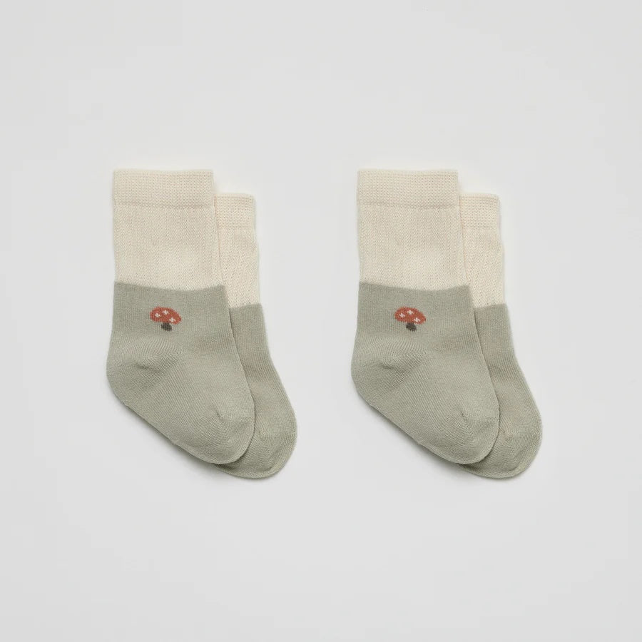 Over the Dandelions Set of 2 Baby Socks in sage green and ivory Mushroom design at Cerise. Made from soft organic cotton to fit newborn babies size 0 to 6 months.