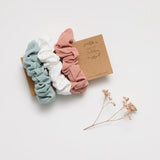 Over the Dandelions Hair Scruchies at Cerise.  Sold as a set of 3 in Rosy Pink, Frost Blue, and White. Made from a soft cotton and linen blend.