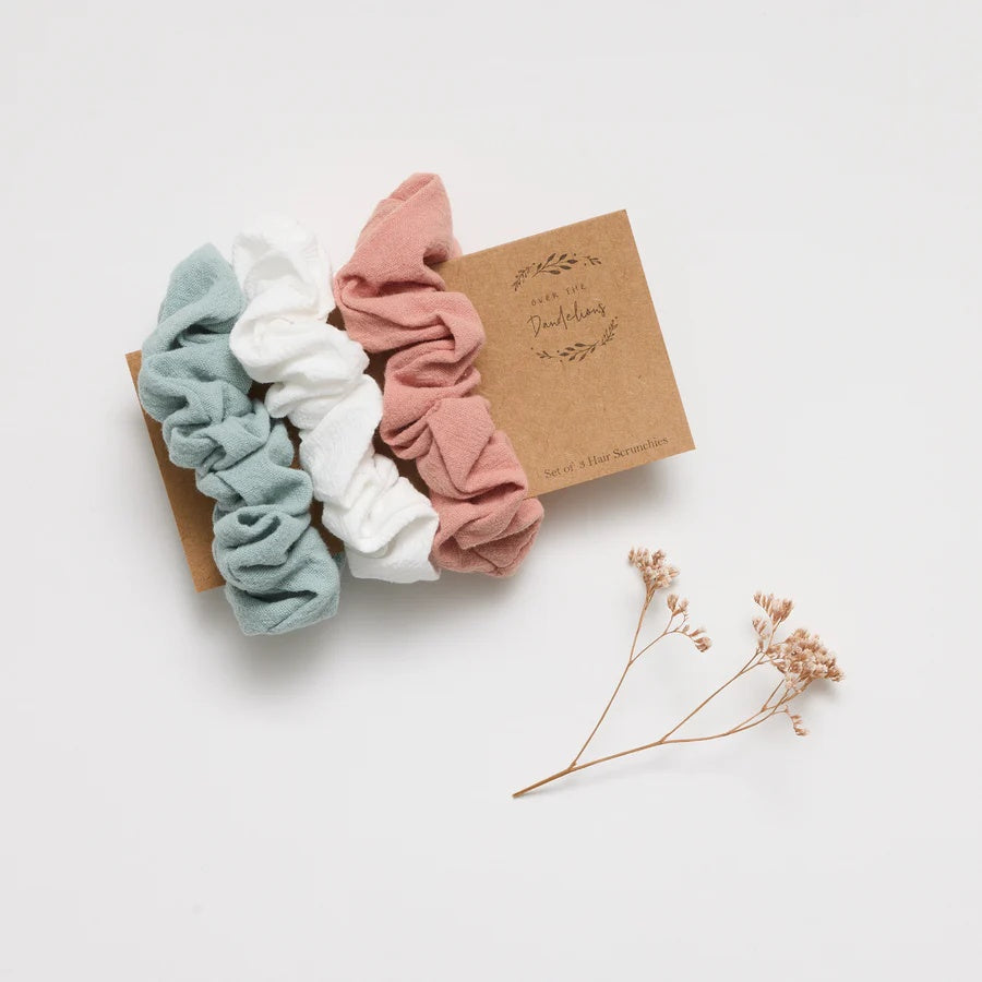 Over the Dandelions Hair Scruchies at Cerise.  Sold as a set of 3 in Rosy Pink, Frost Blue, and White. Made from a soft cotton and linen blend.