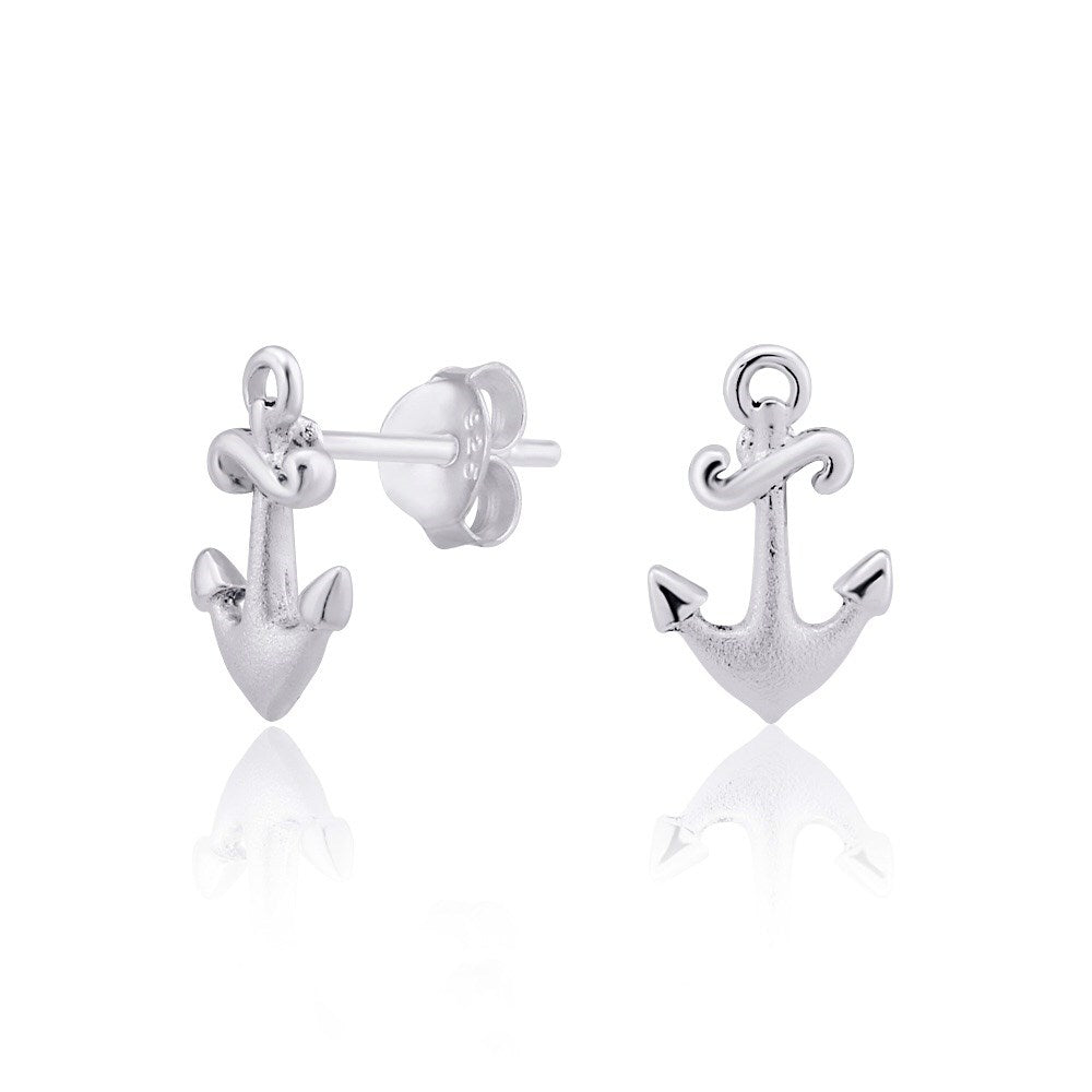 Pair of silver studs with an anchor and a NZ Koru design