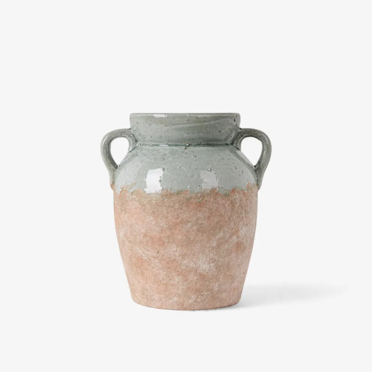Ceramic vase with two-tone design on a white background
