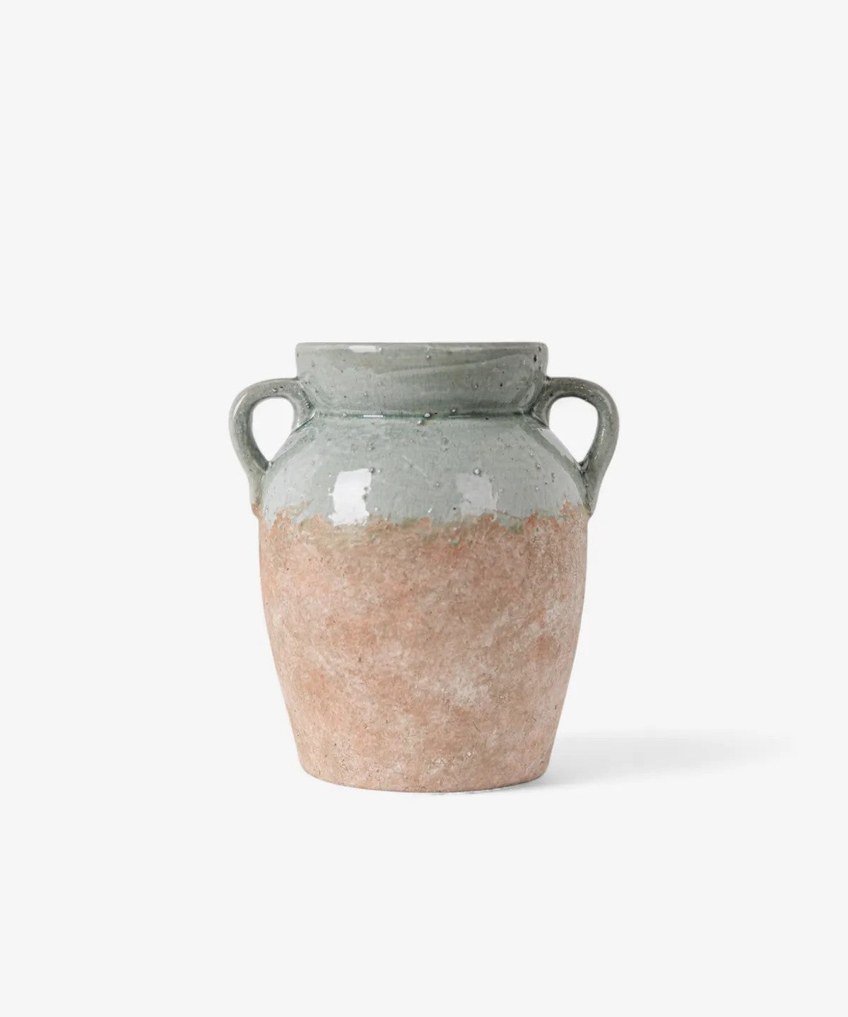 Ceramic vase with two-tone design on a white background