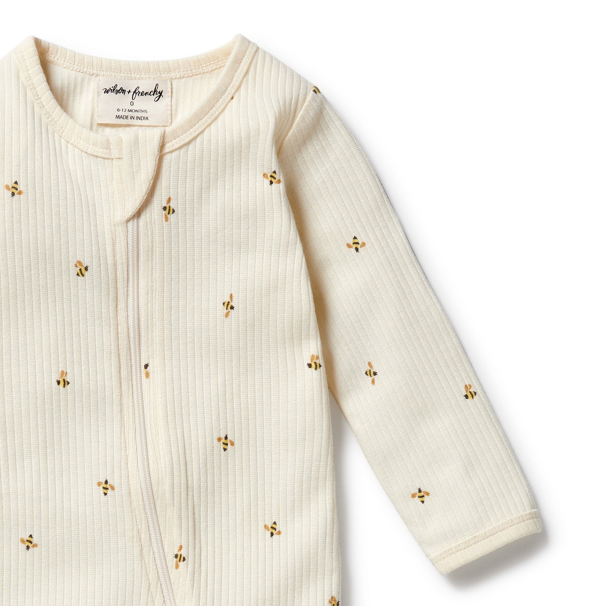 Top of footed bee patterned onsie showing two way zip