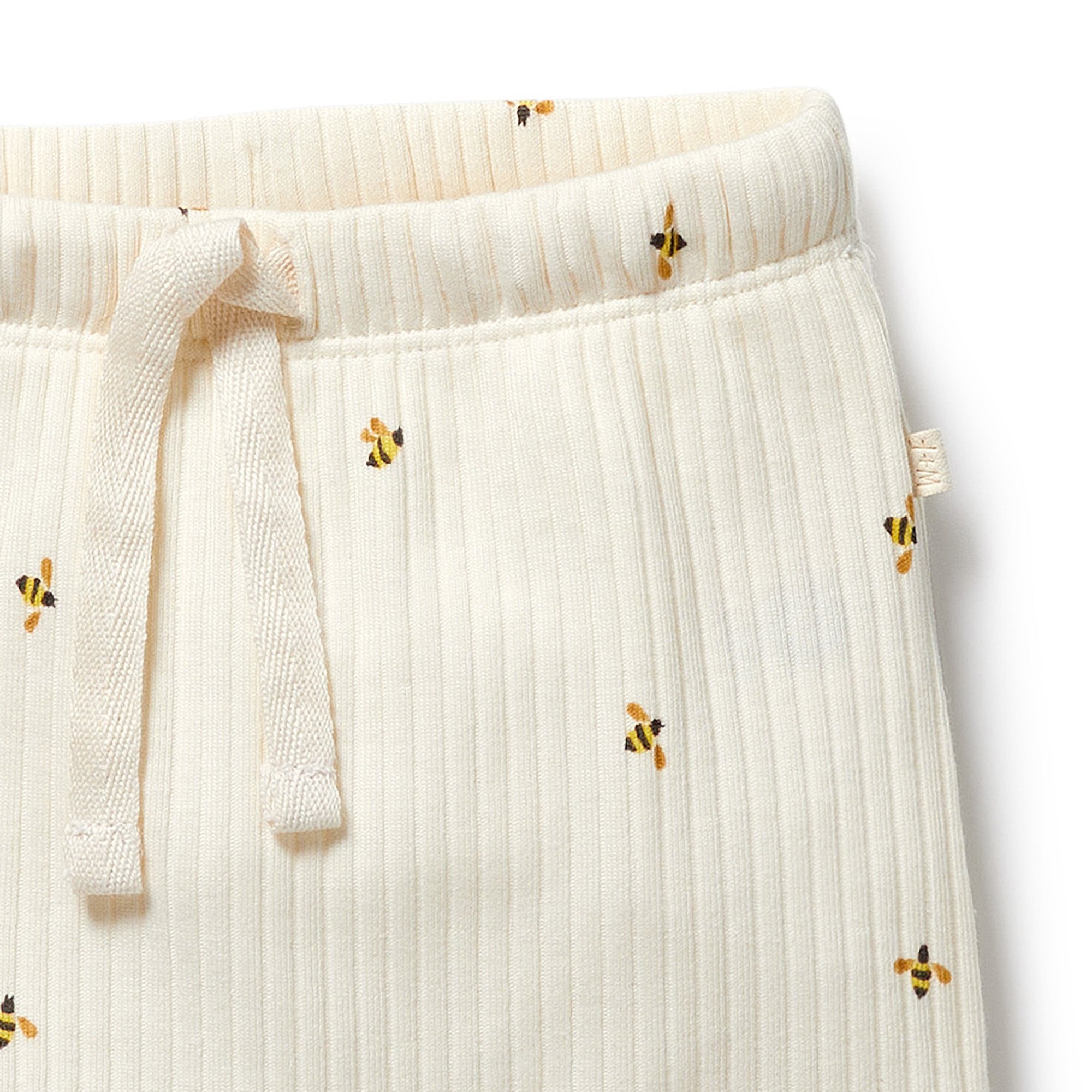 Natural coloured ribbed knit pants with bee print