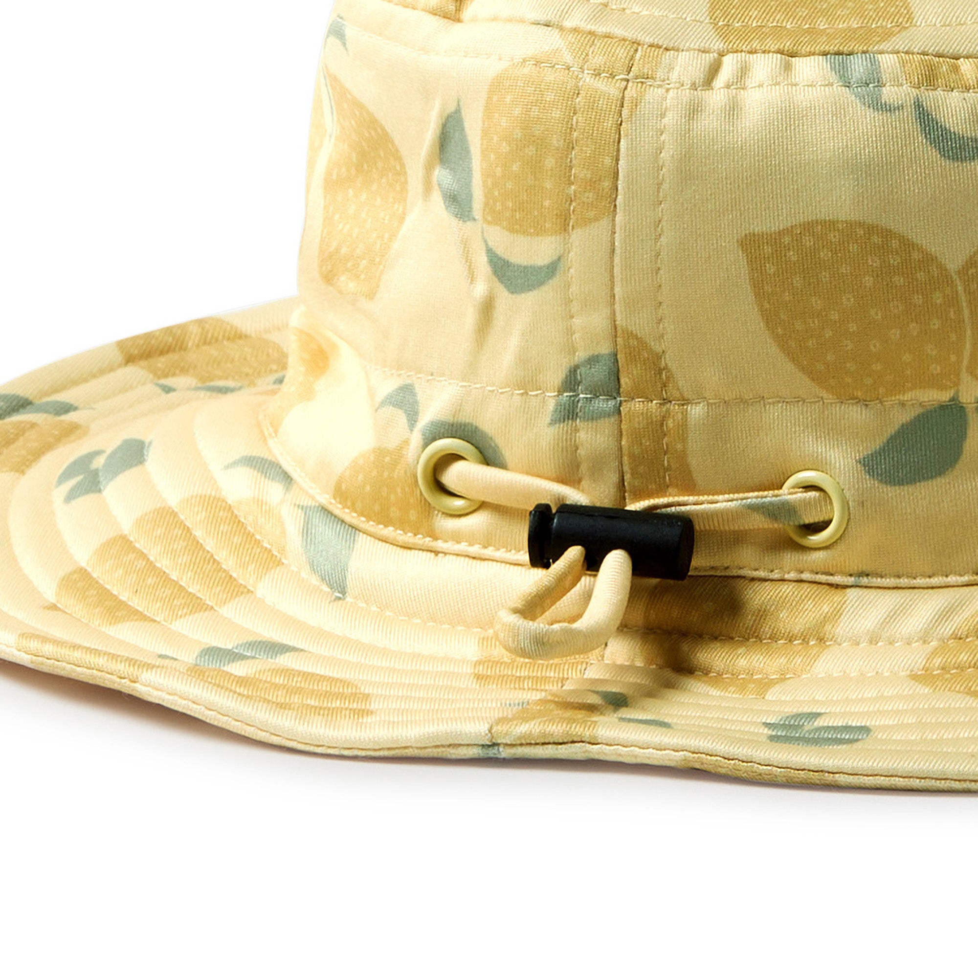 Yellow swim hat with lemon pattern on a white background