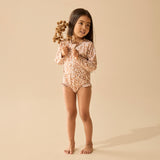 Girl wearing Floral pattern on brown background long sleeved swimsuit or girls