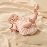 Baby wearing Soft strawberry colour and white stripes playsuit with tie straps and shirred legs