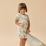 Child wearing  Yeti patterneed short sleeved pyjamas