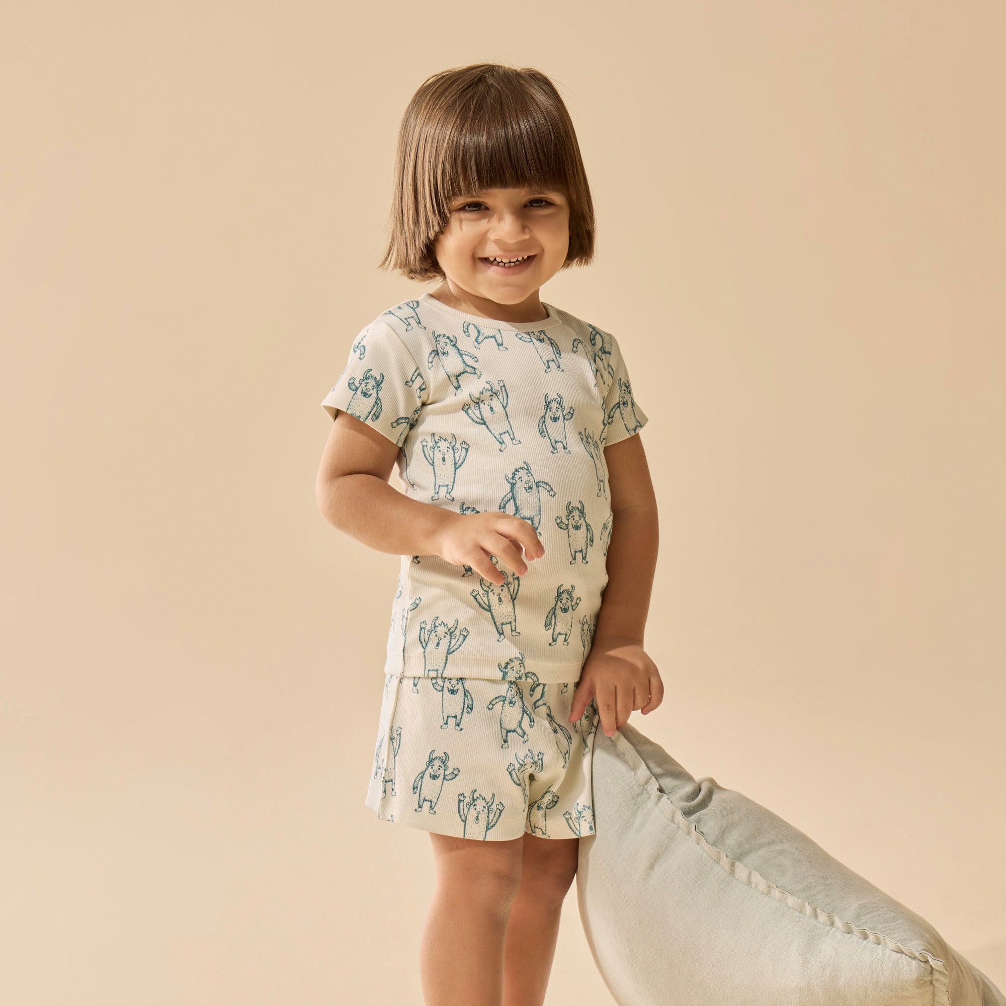 Child wearing  Yeti patterneed short sleeved pyjamas