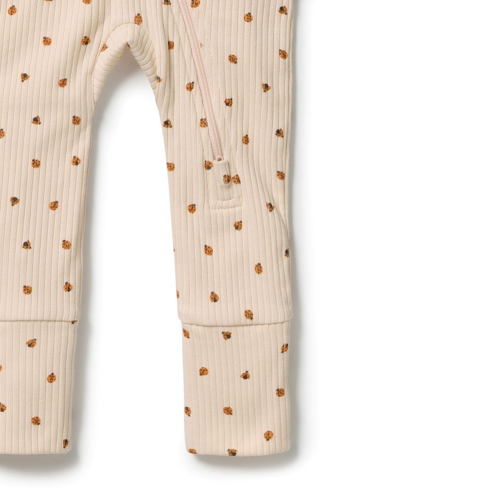 Wilson & Frenchy Zipsuit with Feet in Little Lady Bugs print at Cerise. Wilson & Frenchy Zipsuit with Feet in Little Lady Bugs print at Cerise. This practical footed zipsuit features fold-over mittens (newborn to 000) to protect baby's delicate face, enclosed feet for warmth, and a two-way zip closure for effortless nappy changes.