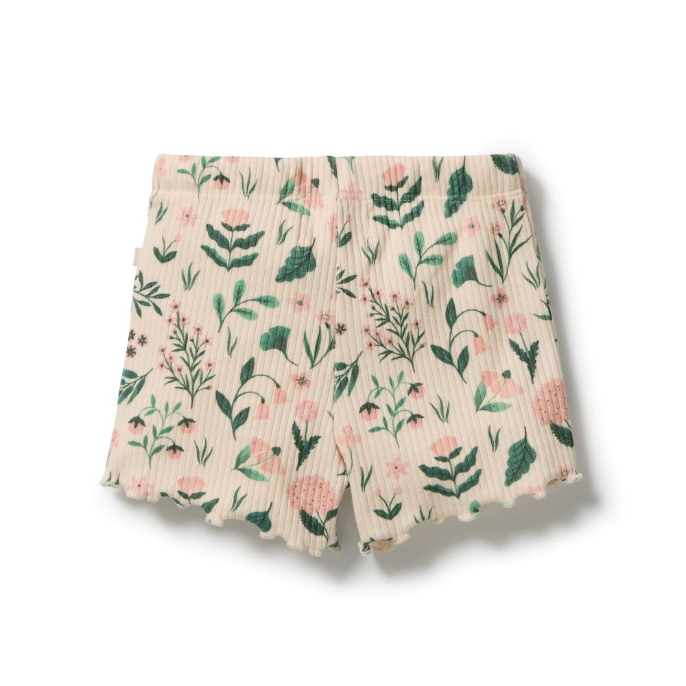 Wilson & Frenchy Sweet Bloom Organic Short in cotton drop needle at Cerise. Designed with a comfortable slim fit, these organic cotton shorts feature a soft elasticated waistband and adjustable ties for an easy, secure fit. The functional drawstring adds practical detail, while the delicate babylocked hem gives these kids’ shorts a sweet, refined finish.
