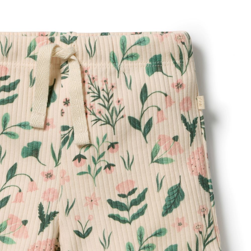 Wilson & Frenchy Sweet Bloom Organic Short in cotton drop needle at Cerise. Designed with a comfortable slim fit, these organic cotton shorts feature a soft elasticated waistband and adjustable ties for an easy, secure fit. The functional drawstring adds practical detail, while the delicate babylocked hem gives these kids’ shorts a sweet, refined finish.