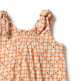 Wilson & frenchy Organic Crinkle Tie Playsuit in Checkerberry Print at Cerise. Mock tie shoulder straps, gentle chest shirring and soft ruffle leg openings add cute details to this easy everyday style.

Practical  snap closures at the crotch make nappy changes quick and simple, making the Checkerberry Playsuit a convenient choice for busy parents.