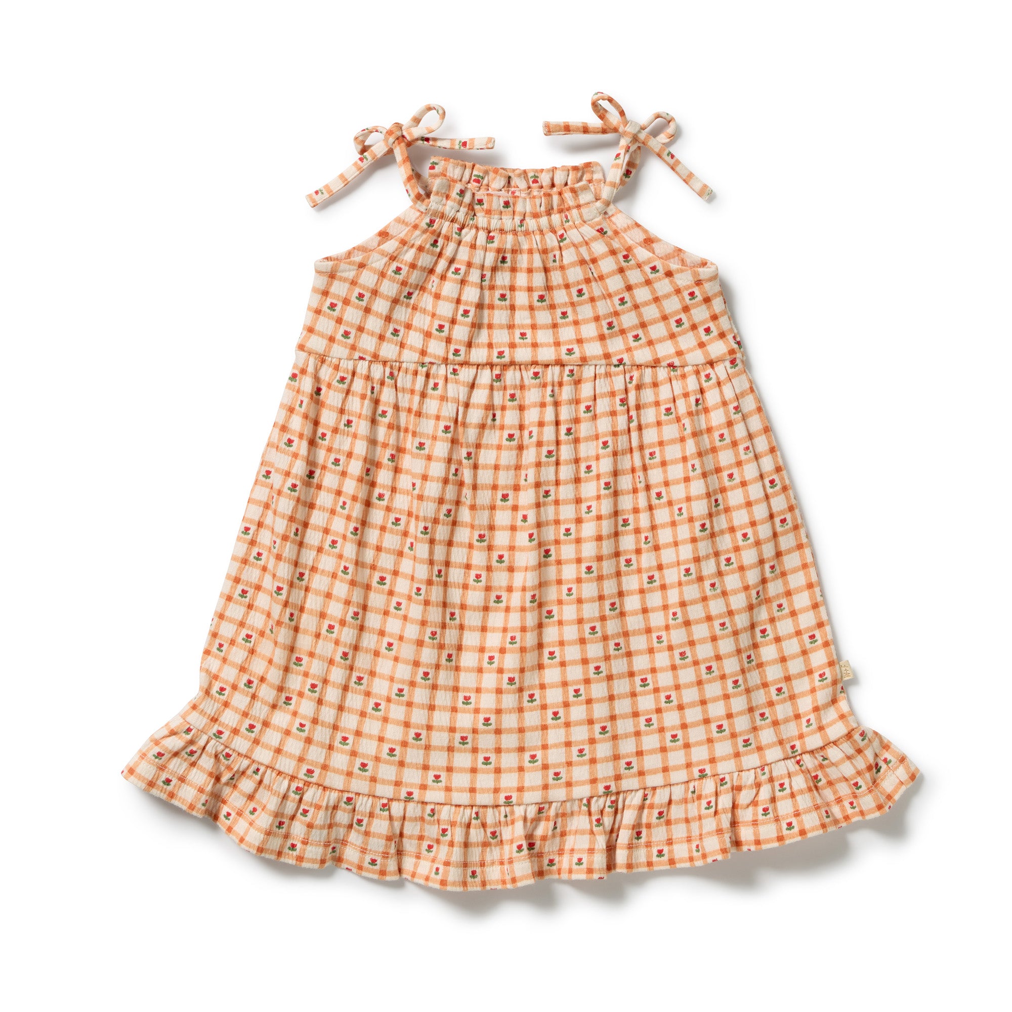 Wilson & Frenchy Checkerberry organic crinkle ruffle dress at Cerise. Designed with a flattering halter neckline, adjustable shoulder ties and a soft ruffle hem, the Checkerberry dress combines effortless style with practical comfort. The loose fit allows plenty of room to move, while the lightweight crinkle fabric feels soft and breathable against the skin 
