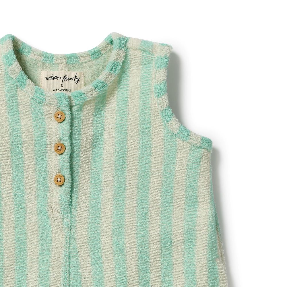 Wilson & Frenchy Seafoam Stripe Organic Terry Growsuit at Cerise. A classic Henley-style button front with mock wood buttons adds a charming, timeless detail. Practical snap closures at the crotch make nappy changes quick and easy, making this baby growsuit a convenient everyday essential for babies on the move.