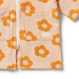 Wilson & Frenchy Daisy Glow Organic Terry Hooded Towel at Cerise. Designed with a practical zip-up front, this mid-length hooded towel is easy to pop on when it’s time to get dry. The relaxed fit allows plenty of room for comfortable movement, while two handy front patch pockets provide a practical place for little hands or small treasures.