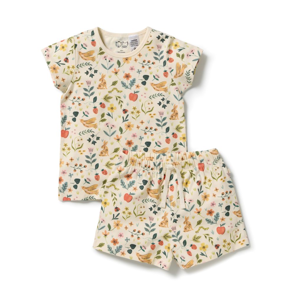 Wilson & Frenchy Kids summer Garden Organic Short sleeve Pyjamas at Cerise. Featuring a lightweight short-sleeve tee and relaxed mid-length shorts, this summer pyjama set offers an easy fit that gives kids plenty of freedom to move. The soft elasticated waistband sits gently on little tummies, making these organic cotton pyjamas comfortable enough for bedtime, lazy mornings and lounging at home.