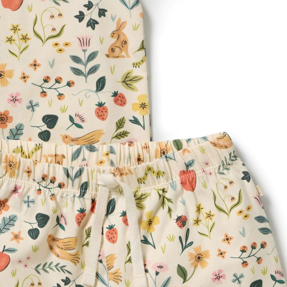 Wilson & Frenchy Kids summer Garden Organic Short sleeve Pyjamas at Cerise. Featuring a lightweight short-sleeve tee and relaxed mid-length shorts, this summer pyjama set offers an easy fit that gives kids plenty of freedom to move. The soft elasticated waistband sits gently on little tummies, making these organic cotton pyjamas comfortable enough for bedtime, lazy mornings and lounging at home.