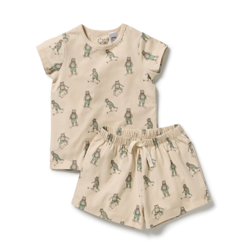 Wilson & Frenchy Kids Skater Club  Organic Short sleeve Pyjamas at Cerise. Featuring a lightweight short-sleeve tee and relaxed mid-length shorts, this summer pyjama set offers an easy fit that gives kids plenty of freedom to move. The soft elasticated waistband sits gently on little tummies, making these organic cotton pyjamas comfortable enough for bedtime, lazy mornings and lounging at home.