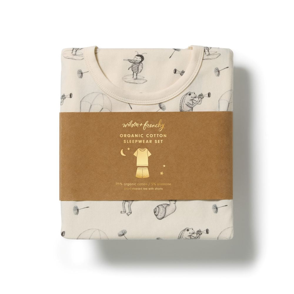 Wilson & Frenchy Kids Whispering Willows Organic Short sleeve Pyjamas at Cerise. Featuring a lightweight short-sleeve tee and relaxed mid-length shorts, this summer pyjama set offers an easy fit that gives kids plenty of freedom to move. The soft elasticated waistband sits gently on little tummies, making these organic cotton pyjamas comfortable enough for bedtime, lazy mornings and lounging at home.