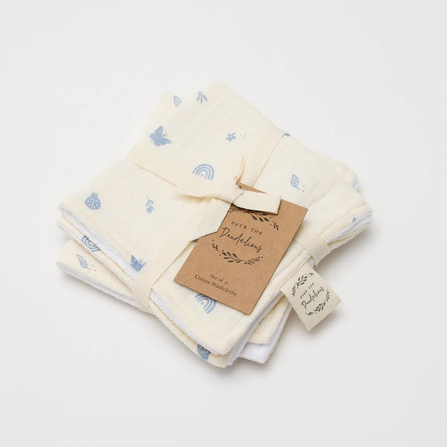 Over the Dandelions Set of 2 Baby Wash cloths in Enchanted Garden  design at Cerise.  Featuring  a gorgeous  pattern of  soft blue icons on a neutral background. Made from 100% organic cotton muslin and cotton terry.