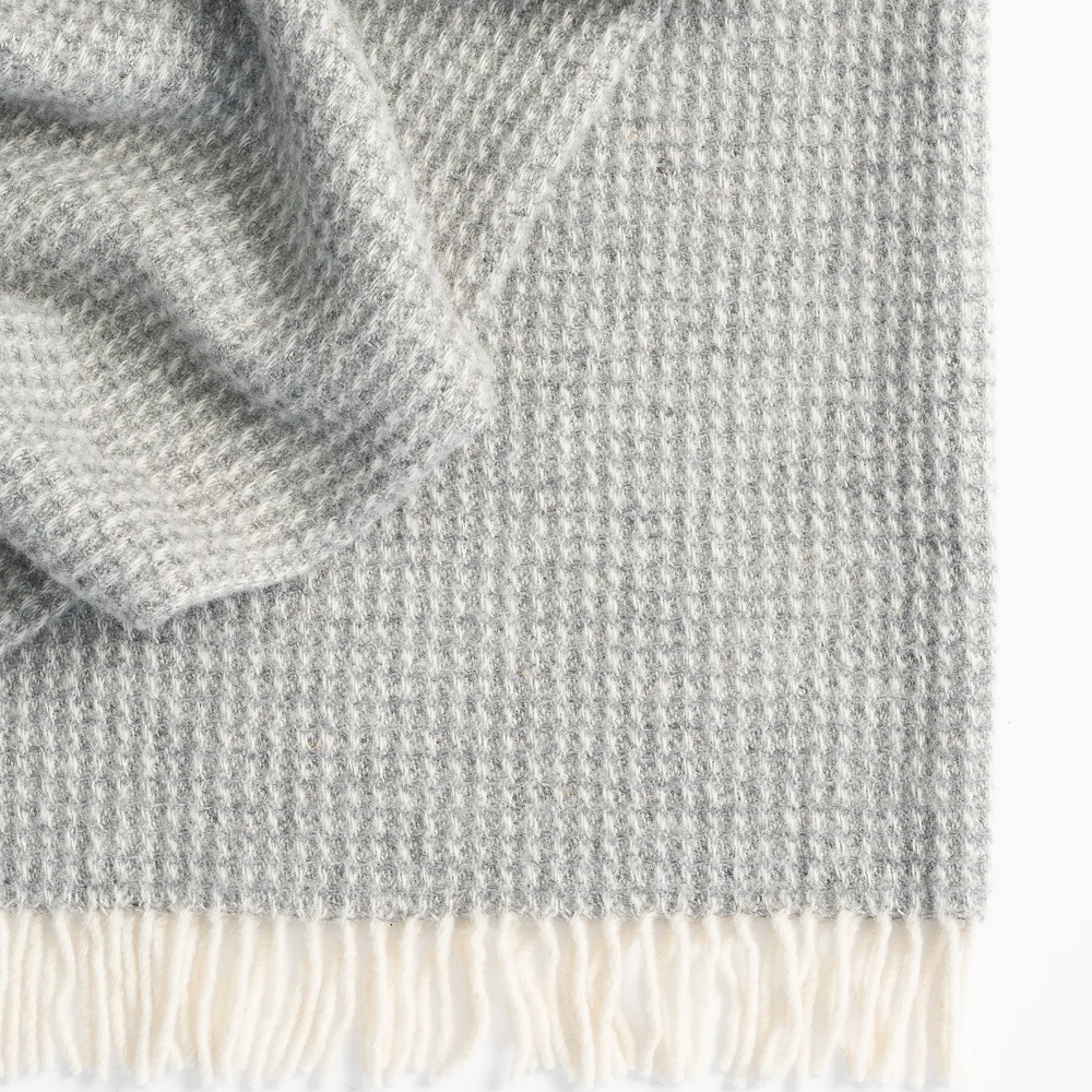 Weave Breckon Throw in Fog colour. at Cerise. Made with 100% NZ Wool in Britain.