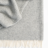 Weave Breckon Throw in Fog colour. at Cerise. Made with 100% NZ Wool in Britain.