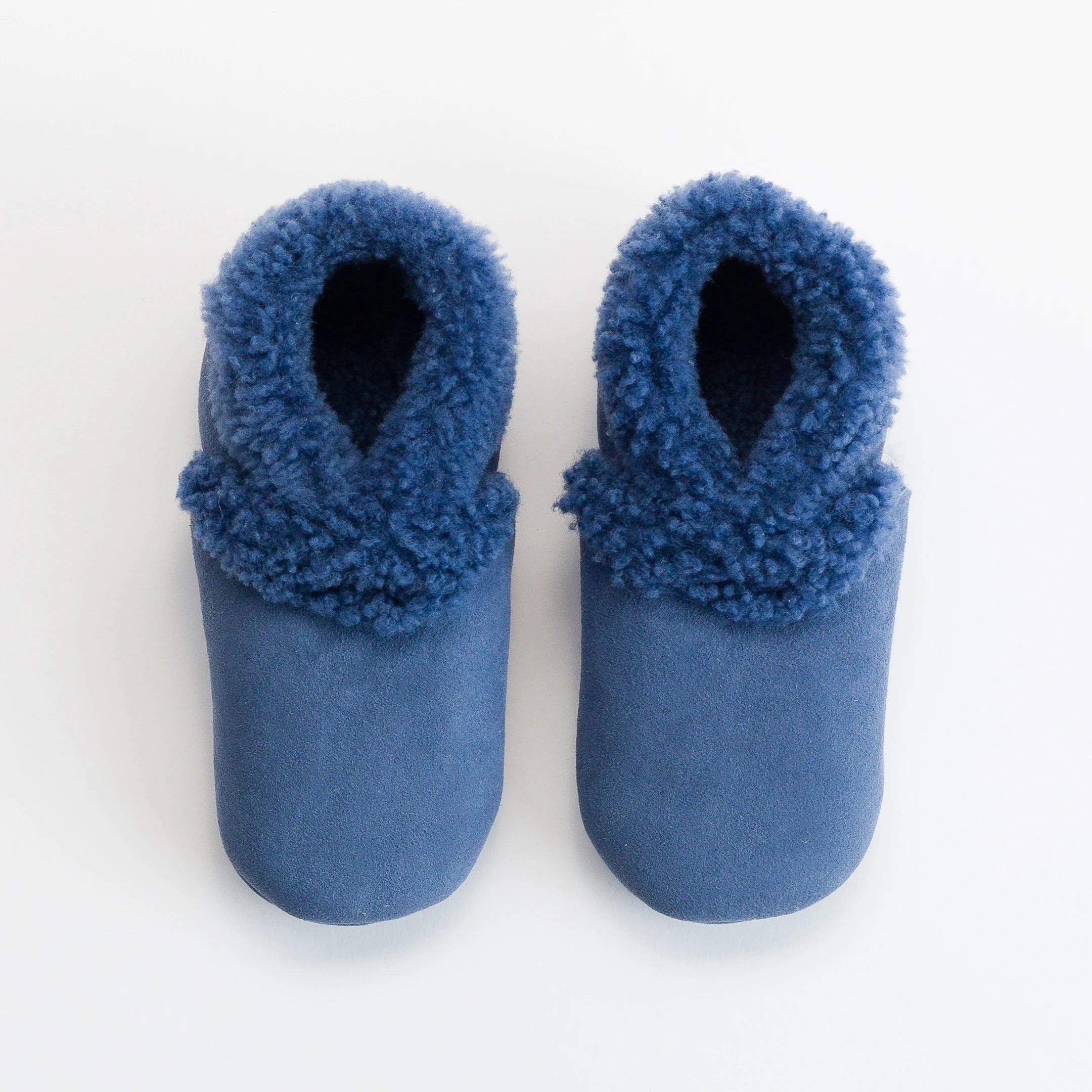 Woolbabe Lambskin Booties in a Midnight Blue Colour at Cerise.  Available in sizes 0 - 2 and made in New Zealand.